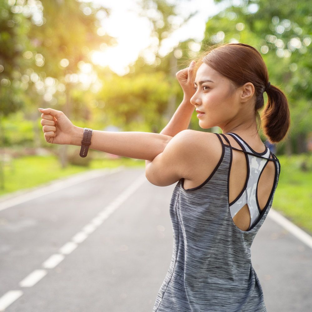 Woman stretching her shoulder