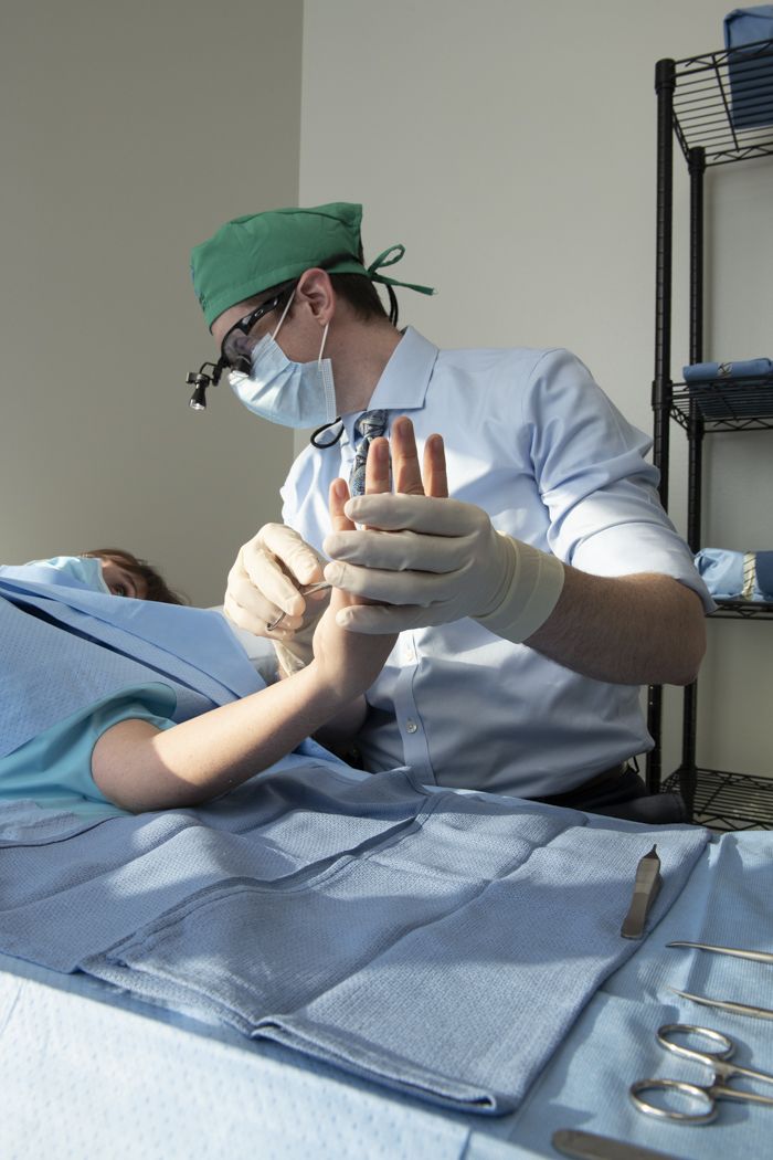 Orthopedic specialist working with patient