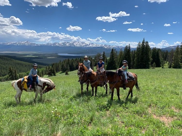 Nathan Lesley, M.D. and his family on horses